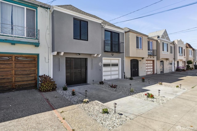 2055 42nd Ave, San Francisco, CA 94116 - view of property featuring stucco siding, a residential view, a balcony, a garage, and driveway