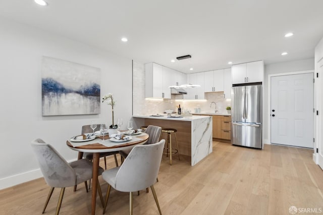 2055 42nd Ave, San Francisco, CA 94116 - dining room featuring light wood finished floors and recessed lighting