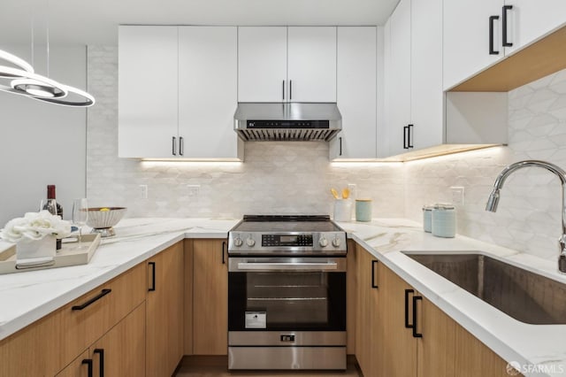 2055 42nd Ave, San Francisco, CA 94116 - kitchen featuring electric range, wall chimney range hood, light stone counters, white cabinets, and tasteful backsplash