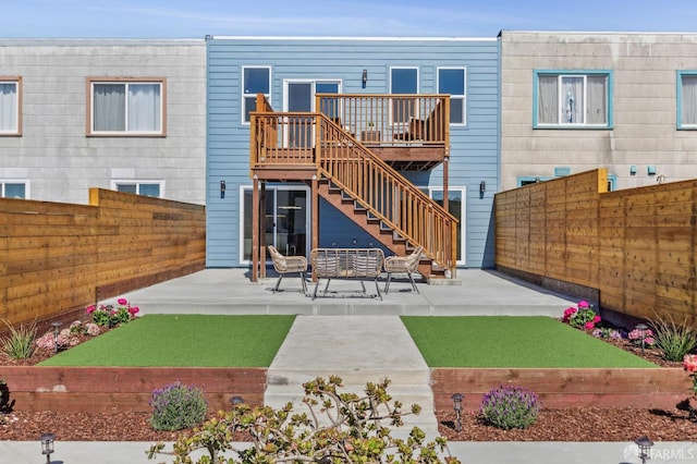 2055 42nd Ave, San Francisco, CA 94116 - back of house featuring a fenced backyard, a deck, a patio area, and stairs
