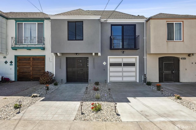 2055 42nd Ave, San Francisco, CA 94116 - multi unit property with driveway, a balcony, stucco siding, an attached garage, and a shingled roof