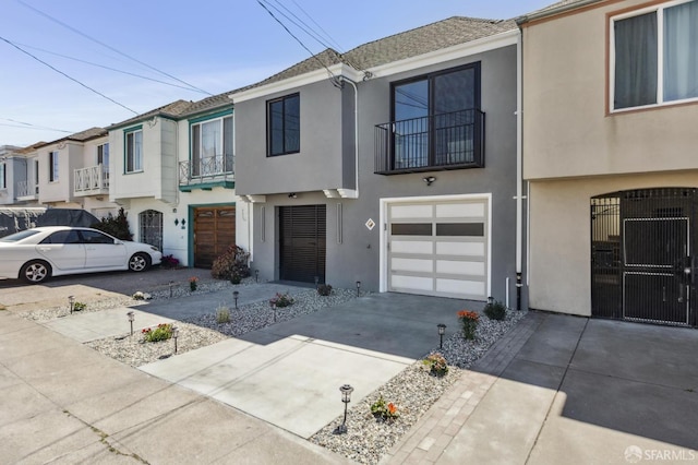 2055 42nd Ave, San Francisco, CA 94116 - view of property with stucco siding, a garage, and a balcony