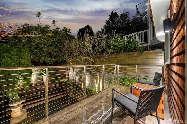 view of balcony at dusk