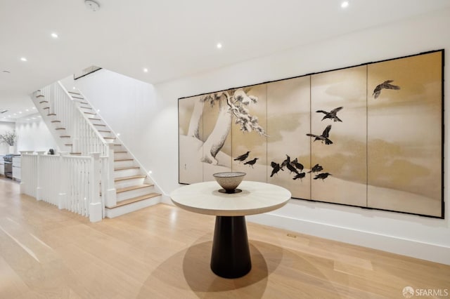 interior space with recessed lighting, stairway, and wood finished floors