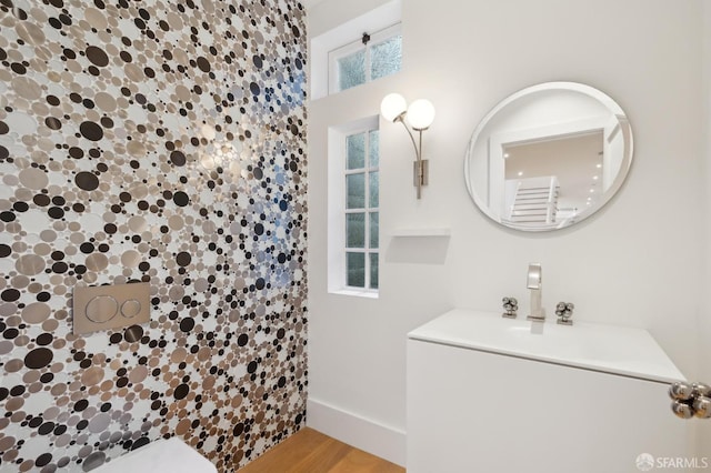 full bath featuring a shower and wood finished floors