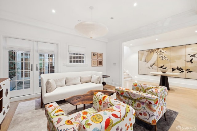 living room featuring light wood-style floors, recessed lighting, french doors, and stairway