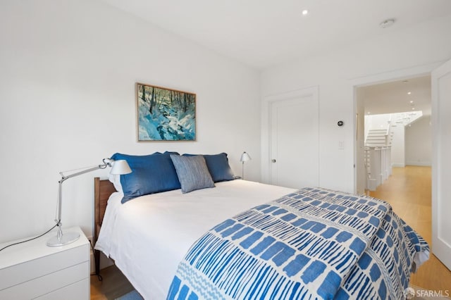 bedroom with wood finished floors