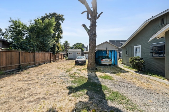 2340 Cooley Ave, East Palo Alto, CA 94303 - view of yard with a shed, driveway, fence, and an outdoor structure