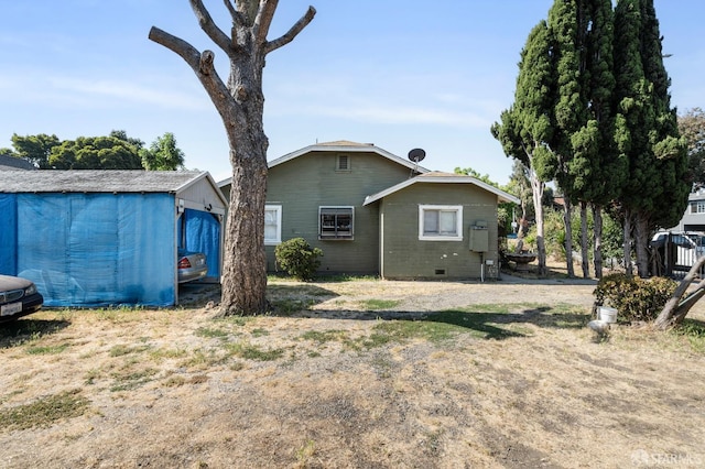 2340 Cooley Ave, East Palo Alto, CA 94303 - rear view of property with crawl space and an outdoor structure