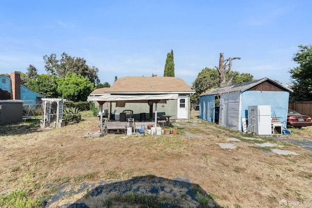 2340 Cooley Ave, East Palo Alto, CA 94303 - rear view of property featuring an outbuilding and a storage unit