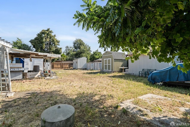 2340 Cooley Ave, East Palo Alto, CA 94303 - view of yard with an outdoor structure, fence, and a storage unit