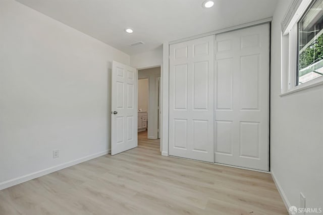 2675 Simas Ave, Pinole, CA 94564 - unfurnished bedroom with light wood-type flooring, recessed lighting, and a closet