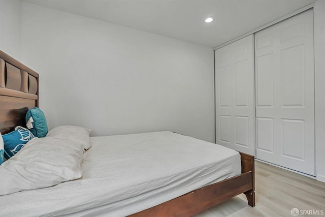 2675 Simas Ave, Pinole, CA 94564 - bedroom with light wood-style flooring, recessed lighting, and a closet