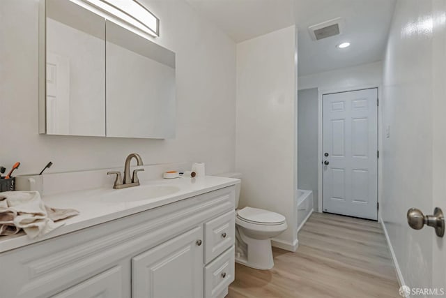 2675 Simas Ave, Pinole, CA 94564 - full bathroom featuring vanity, wood finished floors, a tub, and recessed lighting