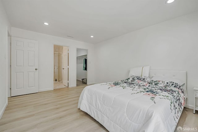 2675 Simas Ave, Pinole, CA 94564 - bedroom featuring light wood-type flooring, recessed lighting, and a spacious closet