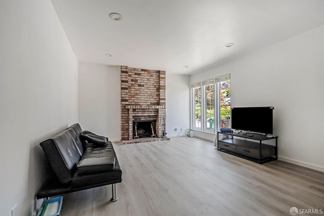 2675 Simas Ave, Pinole, CA 94564 - unfurnished living room featuring wood finished floors, a brick fireplace, and recessed lighting