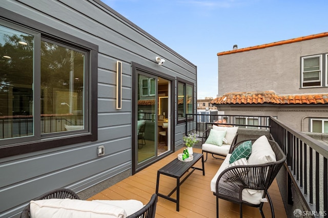 wooden terrace with outdoor lounge area