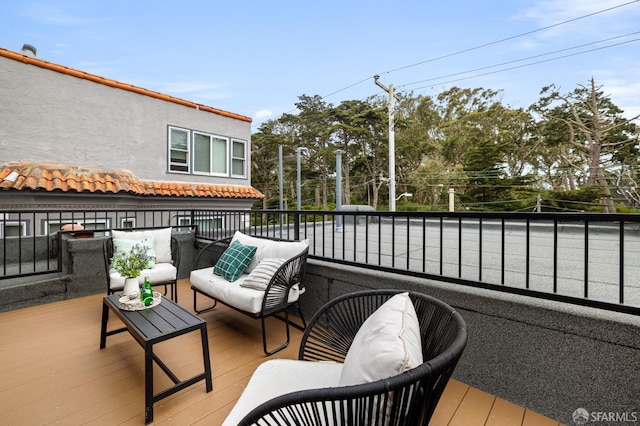 deck with an outdoor hangout area