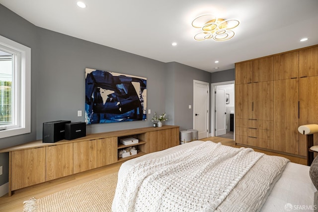 bedroom featuring light wood-type flooring and recessed lighting