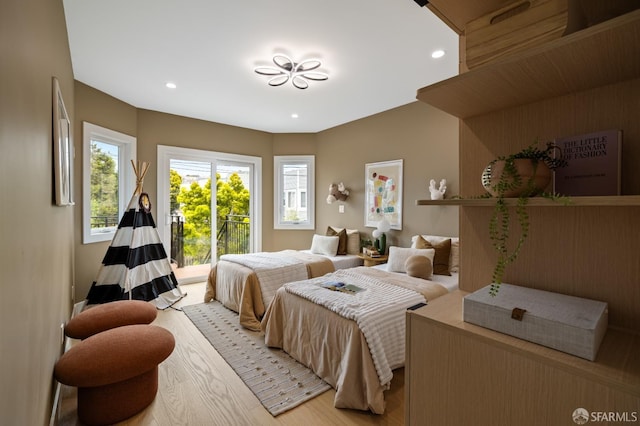 bedroom featuring light wood-style floors and recessed lighting