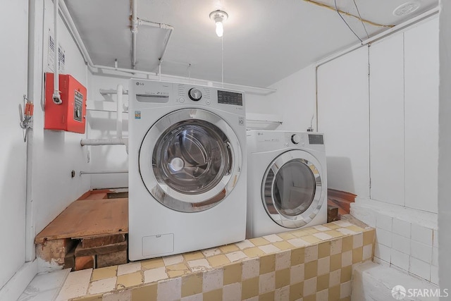 laundry room featuring laundry area and washing machine and clothes dryer