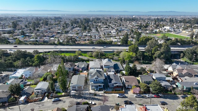 birds eye view of property with a mountain view and a residential view