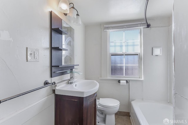 bathroom featuring a bath, vanity, and toilet