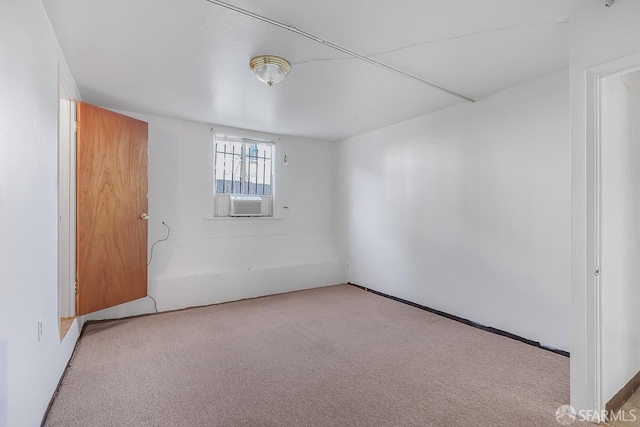 unfurnished room featuring carpet floors and cooling unit