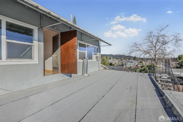 view of side of home with a patio