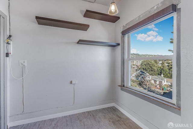 spare room featuring baseboards