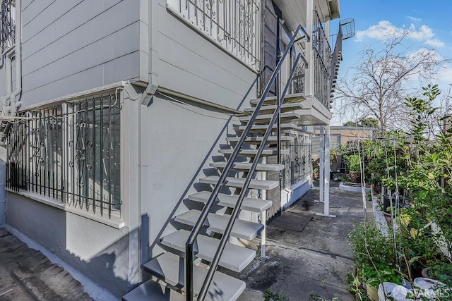 view of property exterior featuring stairway