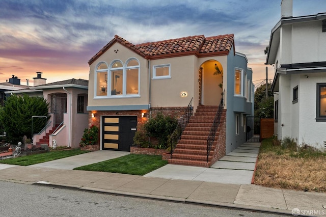 26 Southwood Dr, San Francisco, CA 94112 - view of front of home with stairs, stucco siding, concrete driveway, and an attached garage