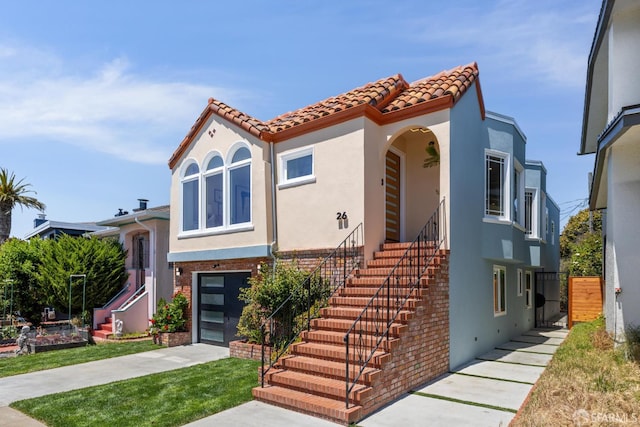 26 Southwood Dr, San Francisco, CA 94112 - mediterranean / spanish-style home with stairs, stucco siding, a tile roof, concrete driveway, and an attached garage