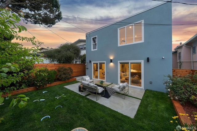 26 Southwood Dr, San Francisco, CA 94112 - back of property at dusk with stucco siding, outdoor lounge area, and a patio area