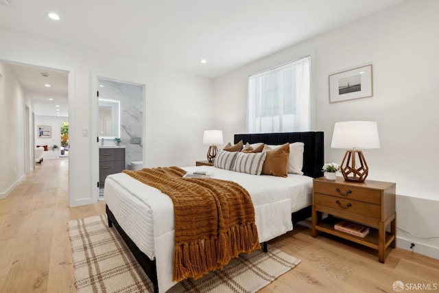 26 Southwood Dr, San Francisco, CA 94112 - bedroom featuring multiple windows, light wood finished floors, recessed lighting, and ensuite bath