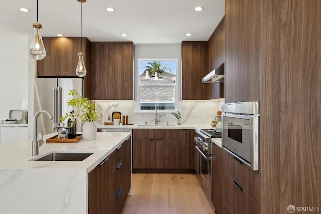 26 Southwood Dr, San Francisco, CA 94112 - kitchen with modern cabinets, a sink, high end appliances, recessed lighting, and light wood-style floors