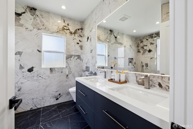 26 Southwood Dr, San Francisco, CA 94112 - full bath with marble tiled floors, double vanity, toilet, a marble finish shower, and recessed lighting