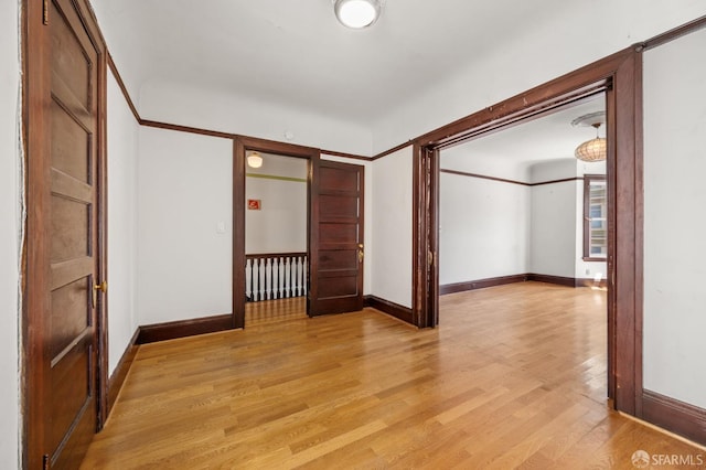 3340 24th St, San Francisco, CA 94110 - empty room with light wood-style floors, baseboards, and radiator