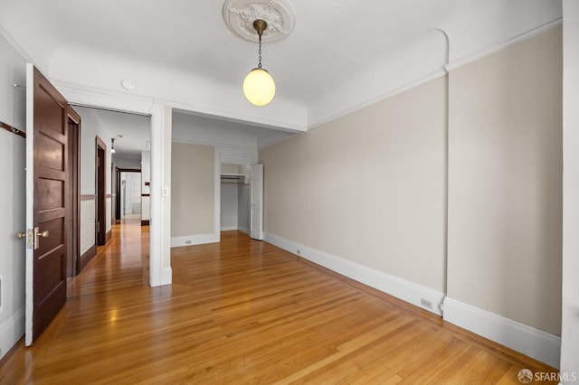 3340 24th St, San Francisco, CA 94110 - unfurnished bedroom with light wood-style flooring, ornamental molding, and baseboards