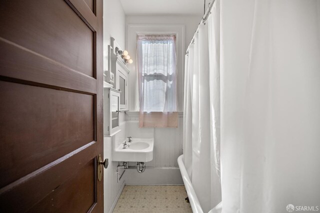 3340 24th St, San Francisco, CA 94110 - bathroom with tile patterned floors and a shower with curtain