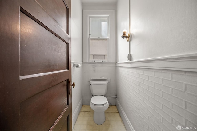3340 24th St, San Francisco, CA 94110 - bathroom featuring toilet and wainscoting