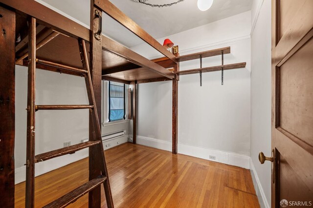 3340 24th St, San Francisco, CA 94110 - unfurnished bedroom with wood finished floors and baseboards