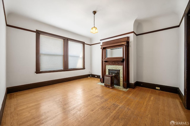 3340 24th St, San Francisco, CA 94110 - unfurnished living room with wood finished floors, baseboards, and a fireplace