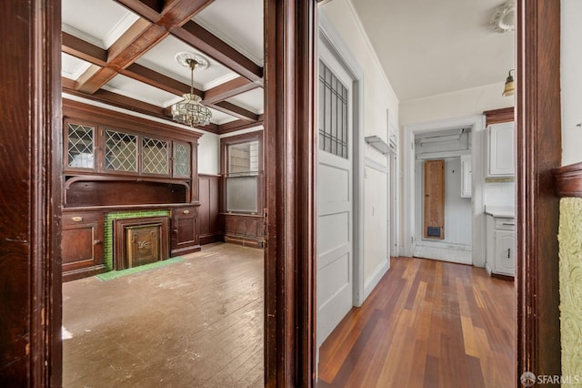 3340 24th St, San Francisco, CA 94110 - hall featuring wood-type flooring, a chandelier, beamed ceiling, a decorative wall, and coffered ceiling