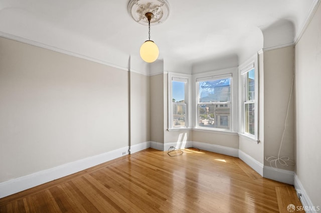 3340 24th St, San Francisco, CA 94110 - empty room featuring baseboards and wood finished floors