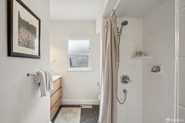 bathroom with vanity and a shower with shower curtain