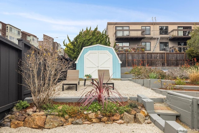 view of patio / terrace featuring a storage shed