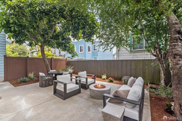 267 Bonview St, San Francisco, CA 94110 - fenced backyard featuring an outdoor living space with a fire pit and a patio area