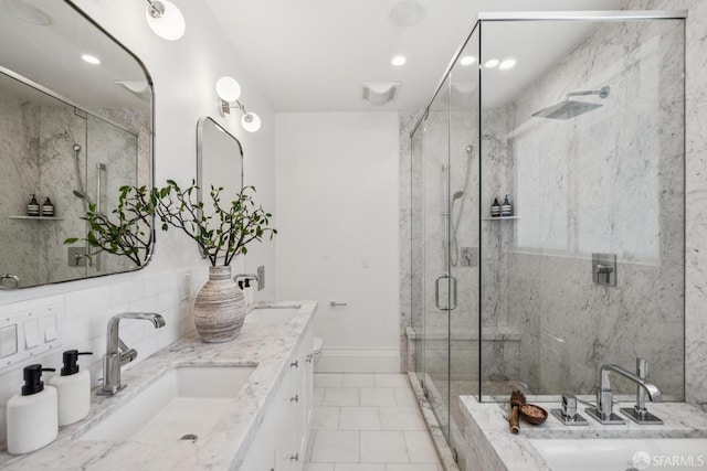 267 Bonview St, San Francisco, CA 94110 - full bathroom with a marble finish shower, double vanity, and recessed lighting