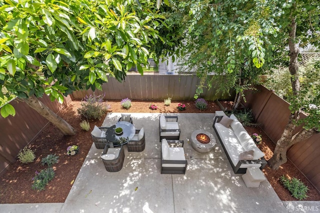 267 Bonview St, San Francisco, CA 94110 - fenced backyard with a patio and an outdoor living space with a fire pit